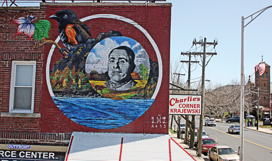 HENRY KRAJEWSKI IS WATCHING YOU – Newark-based artist Lunar New Year (LNY) has completed a mural on the side of Charlie’s Corner in downtown Secaucus. Depicting 1950s presidential candidate Henry Krajewski and other locally inspired images, it is one of a series of murals to be crafted around town. (See brief.)